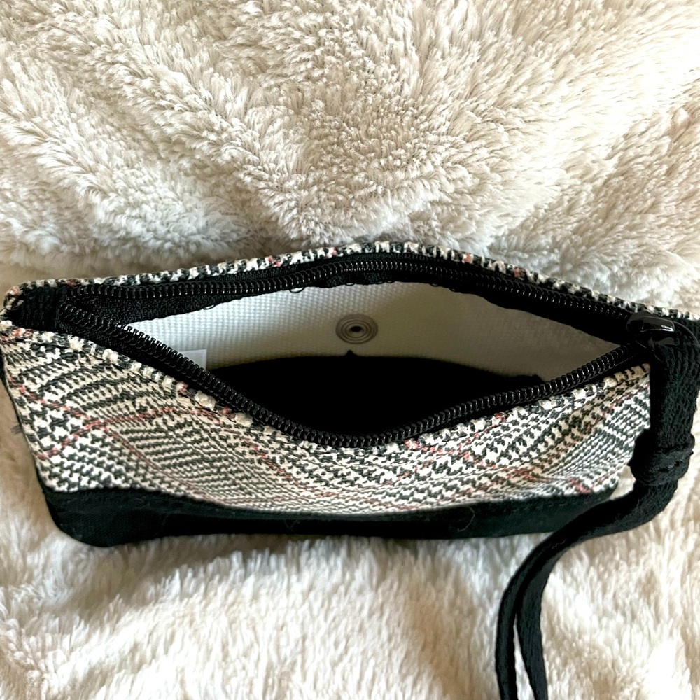 Black/white with red accent stripe wristlet. Outside button close slip pocket. - Picture 4 of 4